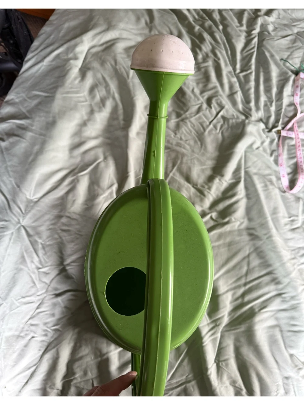 Green Plastic Watering Can with Measurement Markings